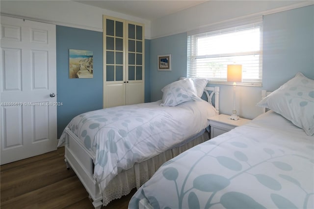 bedroom featuring dark wood-type flooring