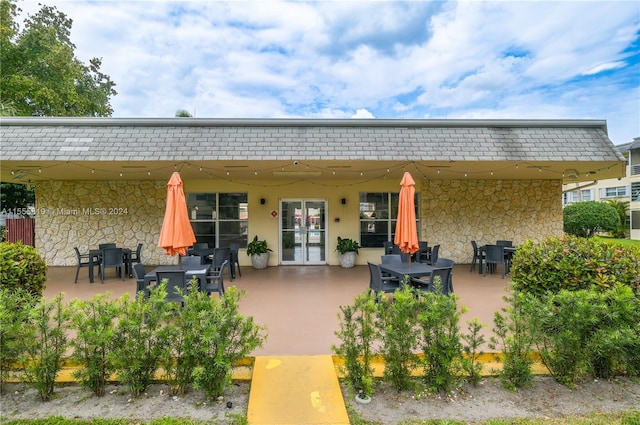 back of property with a patio area