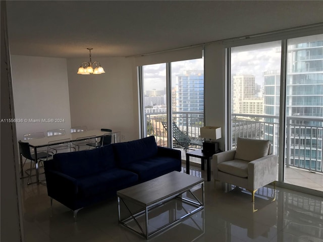 living room featuring a notable chandelier and floor to ceiling windows