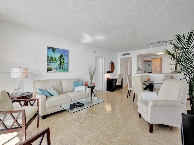 living room featuring a textured ceiling