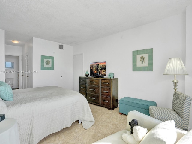 bedroom with a textured ceiling