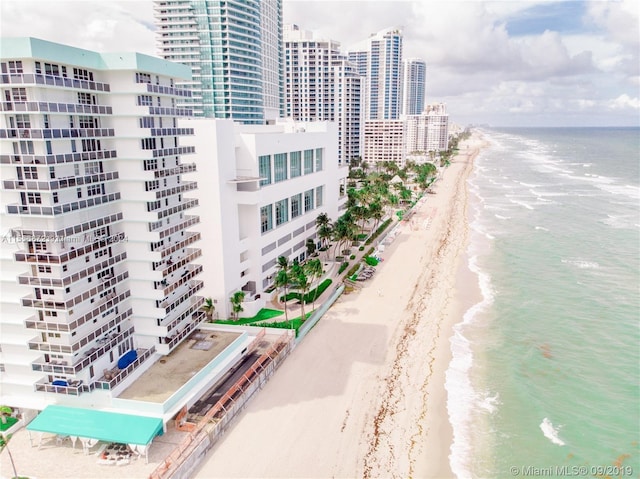 exterior space with a beach view and a water view