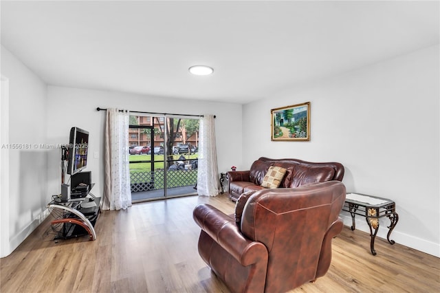 701 SW 142nd Ave Unit 108S, Pembroke Pines, FL 33027 - living room featuring wood finished floors and baseboards