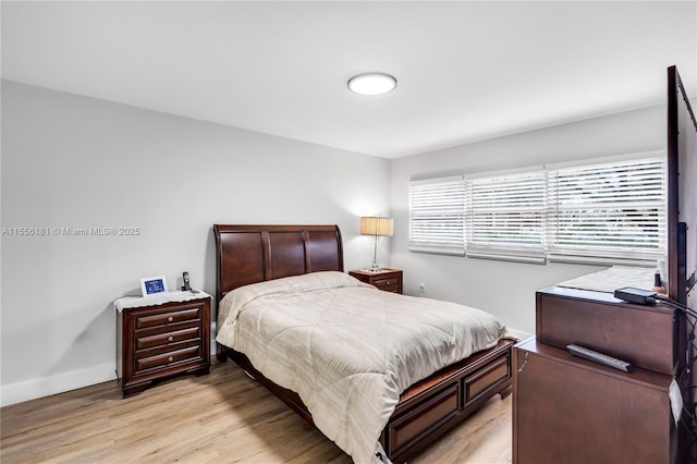 701 SW 142nd Ave Unit 108S, Pembroke Pines, FL 33027 - bedroom with light wood-type flooring and baseboards