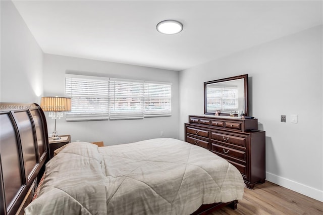 701 SW 142nd Ave Unit 108S, Pembroke Pines, FL 33027 - bedroom featuring wood finished floors and baseboards