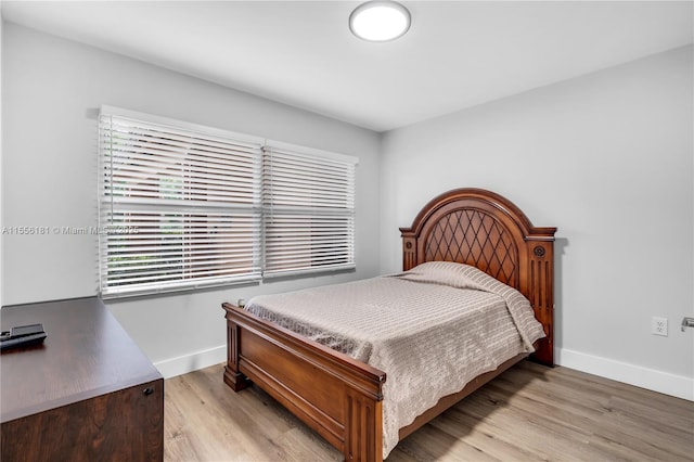 701 SW 142nd Ave Unit 108S, Pembroke Pines, FL 33027 - bedroom featuring baseboards and light wood-type flooring