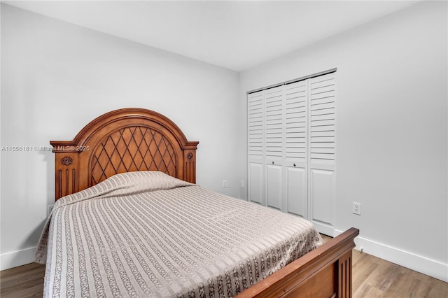 701 SW 142nd Ave Unit 108S, Pembroke Pines, FL 33027 - bedroom featuring light wood-style flooring, a closet, and baseboards