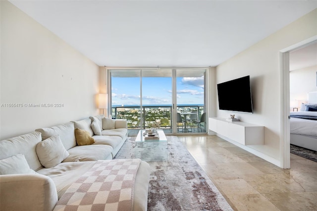 tiled living room featuring expansive windows