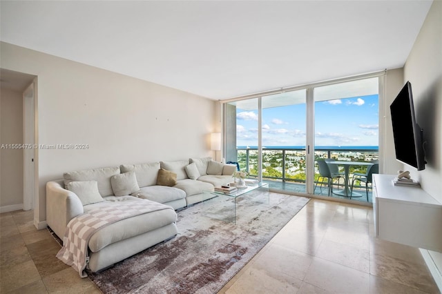 living room featuring floor to ceiling windows and light tile flooring