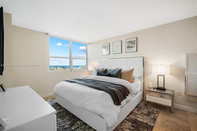 bedroom with tile floors