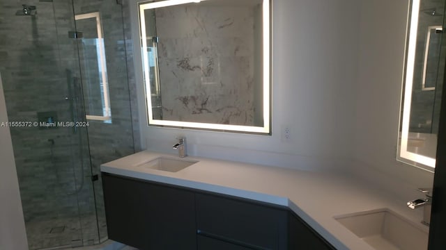 bathroom with walk in shower and vanity