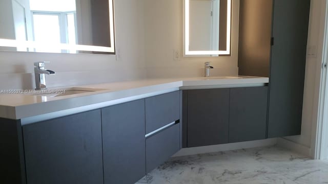 bathroom with tile floors and dual vanity