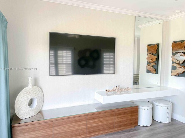 room details with vanity, crown molding, and hardwood / wood-style flooring