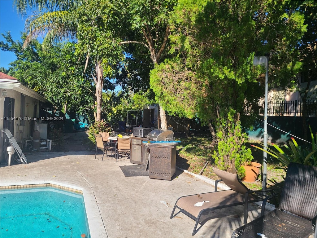 view of swimming pool with a patio