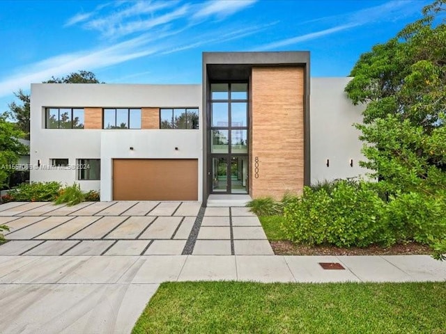 exterior space with french doors and a garage