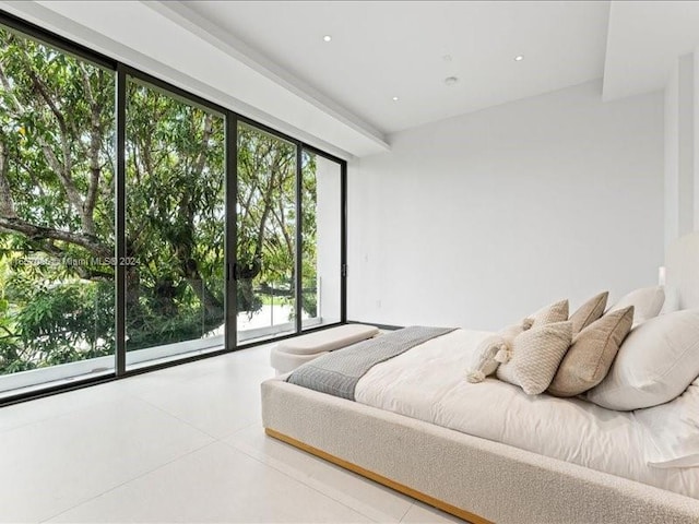 bedroom featuring access to outside, tile patterned floors, and multiple windows