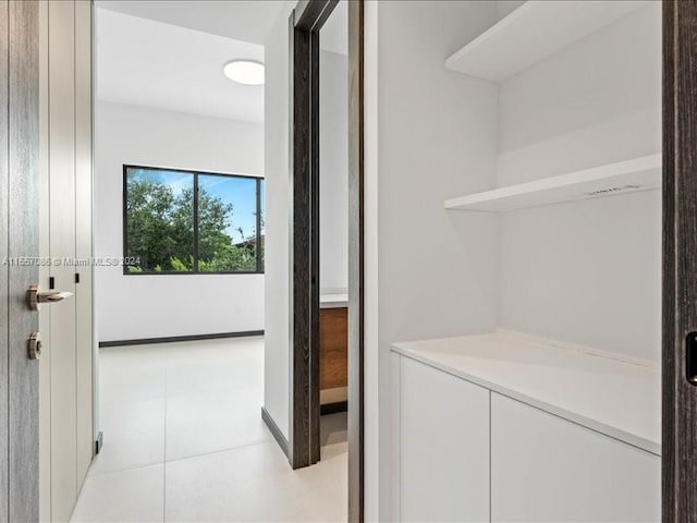 hallway with light tile patterned floors