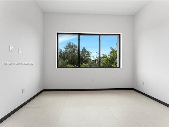 empty room featuring tile patterned floors