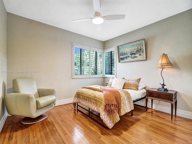 bedroom with ceiling fan and light hardwood / wood-style floors