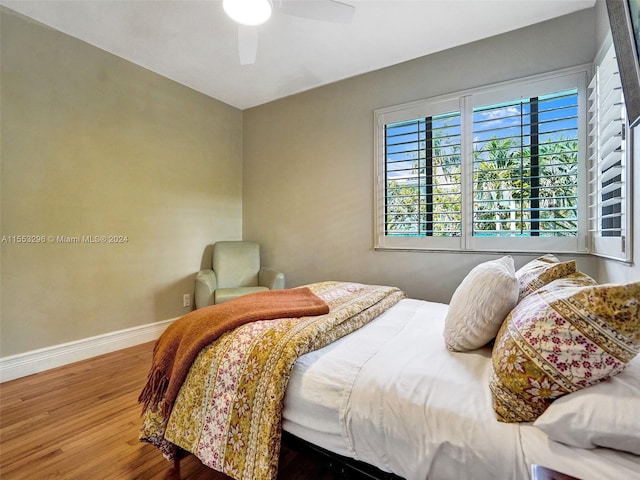 bedroom featuring ceiling fan and hardwood / wood-style flooring