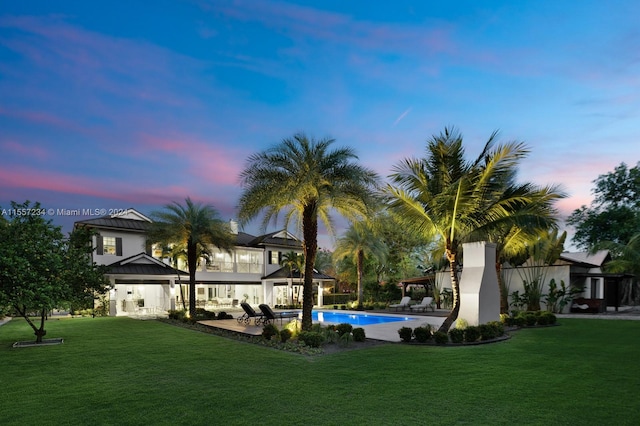 yard at dusk with a patio