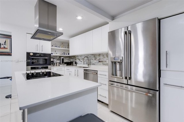 kitchen featuring light tile flooring, appliances with stainless steel finishes, white cabinets, backsplash, and island exhaust hood