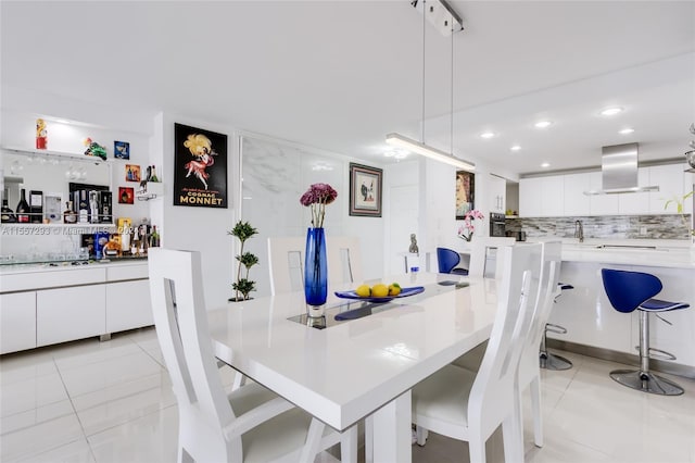 dining space with light tile flooring