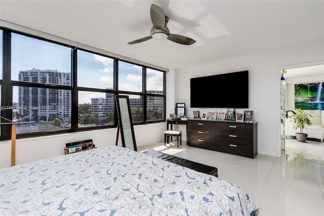 tiled bedroom with ceiling fan