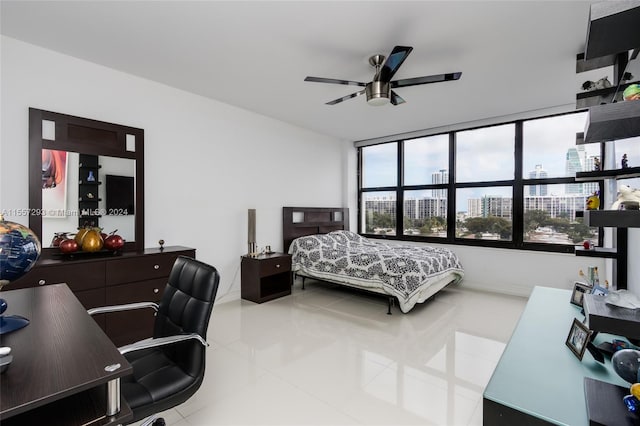 bedroom featuring expansive windows, ceiling fan, and light tile floors