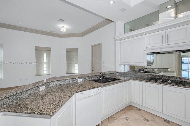 kitchen featuring dark stone countertops, white dishwasher, black electric cooktop, crown molding, and a sink