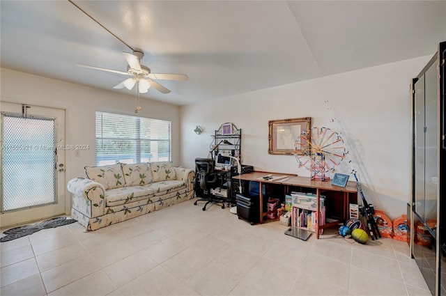 tiled office space featuring ceiling fan