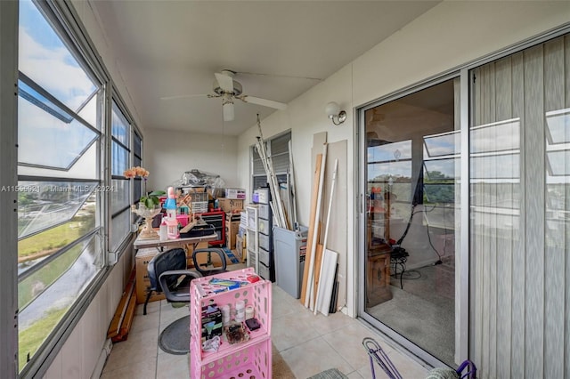 sunroom / solarium featuring ceiling fan and a wealth of natural light