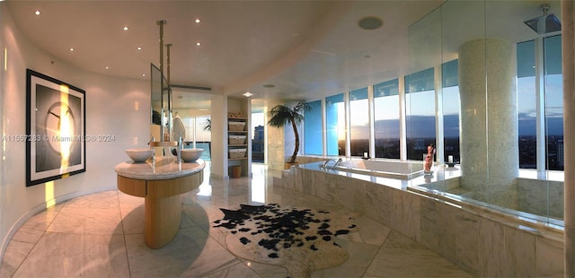 bathroom featuring a bath to relax in, tile floors, and a mountain view