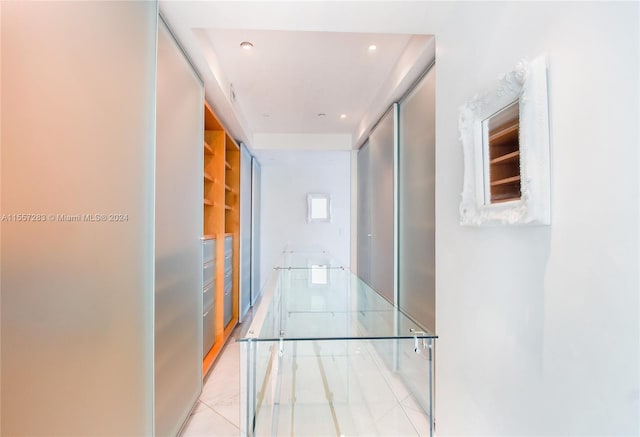 hallway with light tile flooring