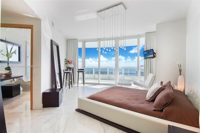 tiled bedroom featuring a water view and expansive windows