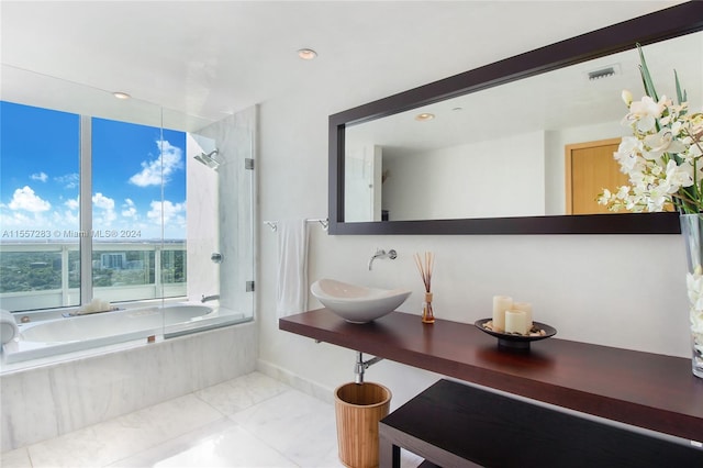 bathroom with tile flooring and sink