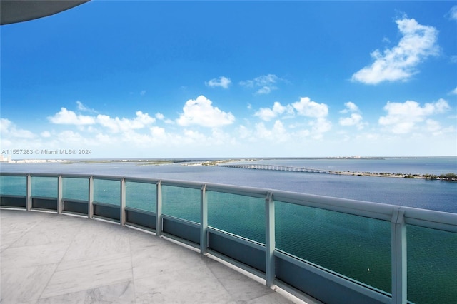 balcony featuring a water view