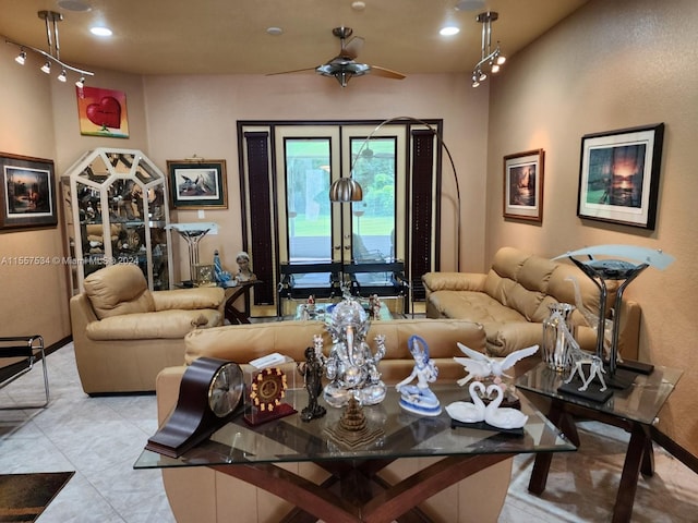 tiled living room featuring french doors and ceiling fan