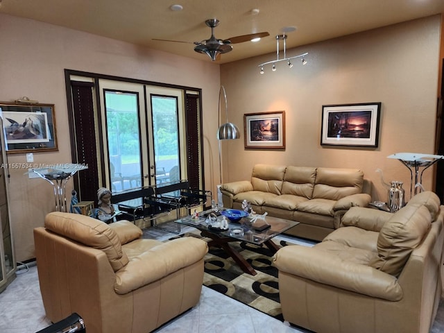 living room featuring light tile floors, ceiling fan, and track lighting