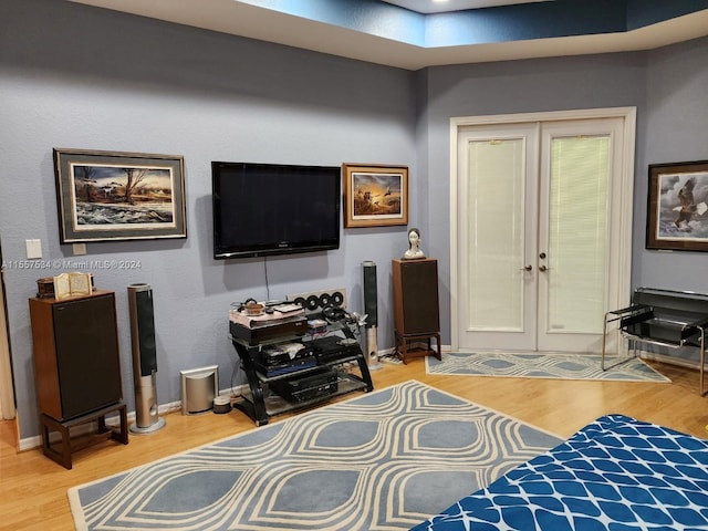 interior space with french doors and light hardwood / wood-style flooring