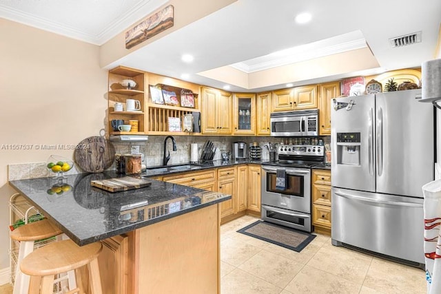 kitchen with light tile floors, kitchen peninsula, tasteful backsplash, appliances with stainless steel finishes, and sink