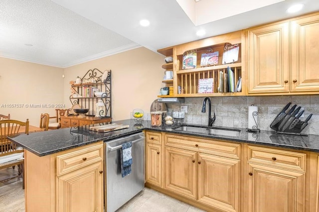 kitchen featuring dark stone counters, stainless steel dishwasher, kitchen peninsula, and sink