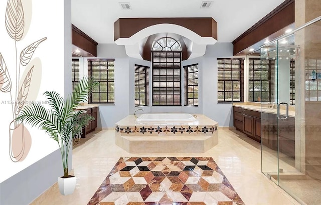 bathroom with vanity, tile floors, and a healthy amount of sunlight