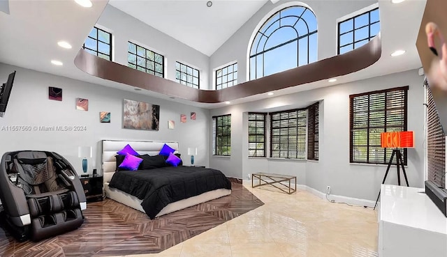 tiled bedroom with a towering ceiling