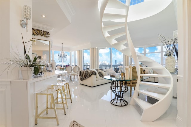 living room featuring ornamental molding, a chandelier, light tile patterned floors, and expansive windows