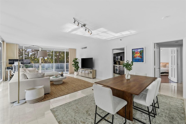 tiled dining area with rail lighting