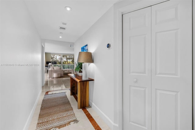 corridor with light tile flooring