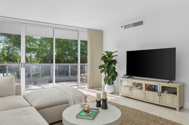 living room with light tile flooring and expansive windows