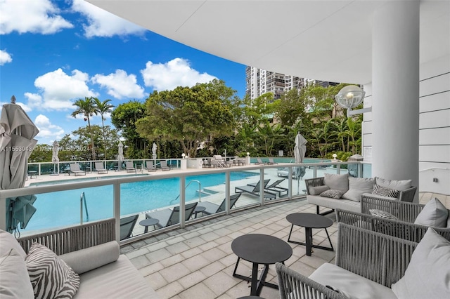 view of swimming pool with an outdoor living space