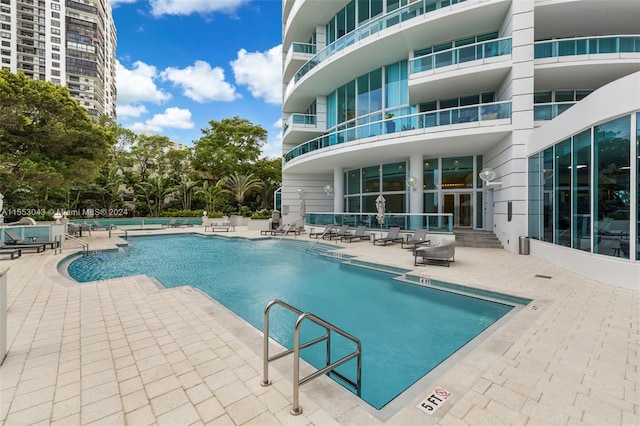 view of pool featuring a patio area